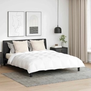 Weißes vidaXL Bettdecken Set mit Kissen (3-tlg) auf einem Bett in einem Schlafzimmer.