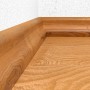 Holzsockelleiste, befestigt mit Fischer Montageklebstoff High Tack AC Weiß, an einer Wand.