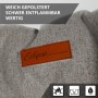 Detailaufnahme: Grauer Eclipse Campingstuhl mit braunem Logo-Patch, robust und bis 150 kg belastbar.