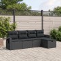 Schwarze 5-tlg. vidaXL Garten-Sofagarnitur aus Poly Rattan mit Kissen im Garten.
