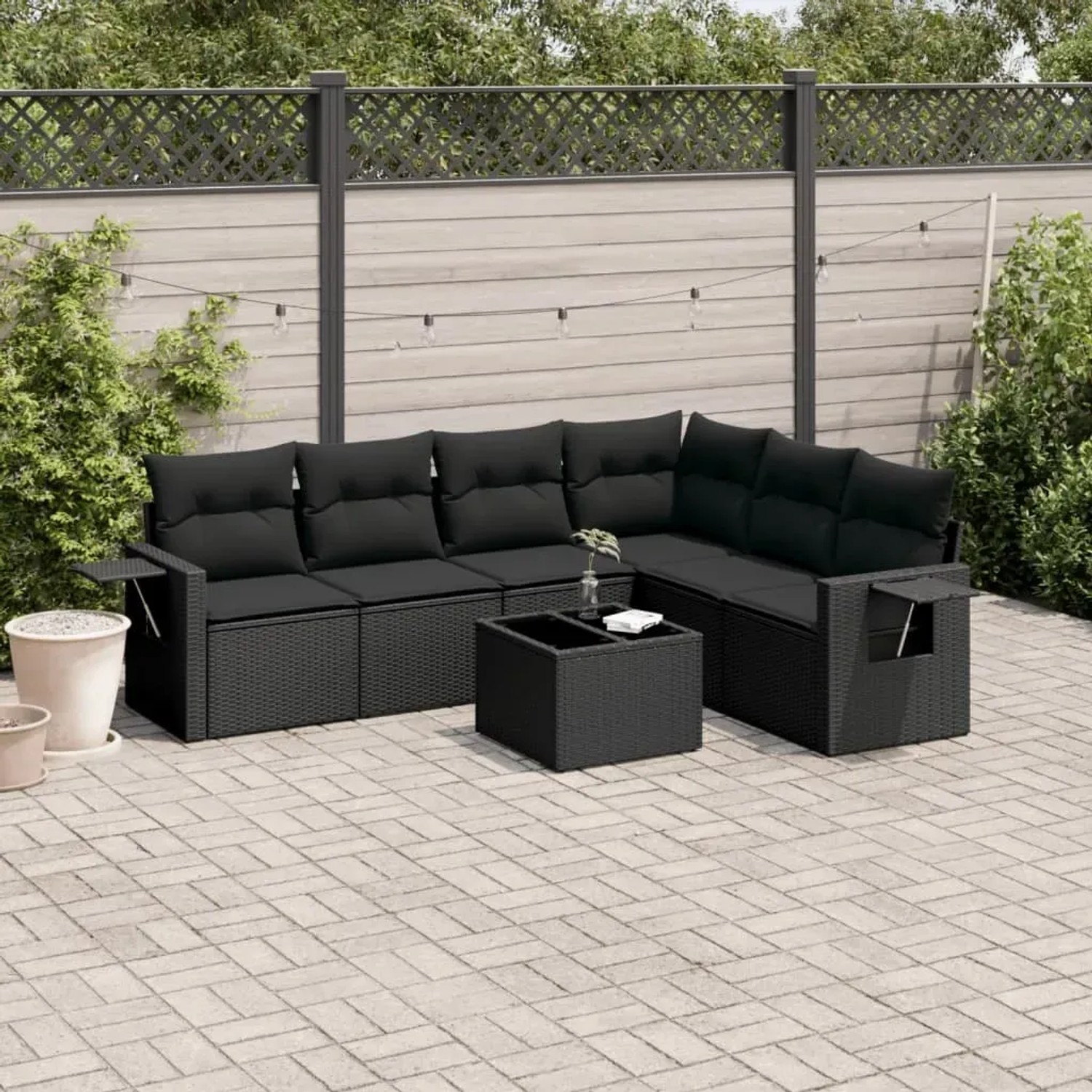 Schwarze 7-tlg. vidaXL Garten-Sofagarnitur aus Poly Rattan mit Kissen.