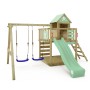 Wickey Spielturm Smart Cave mit Rutsche in Pastellgrün, mit Schaukel und Kletterwand.