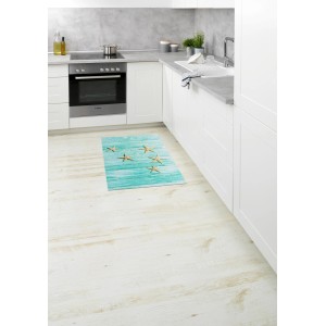 Mehrfarbige Wenko Badematte Mediaster (50x80 cm) mit Seestern-Motiv in Küche.