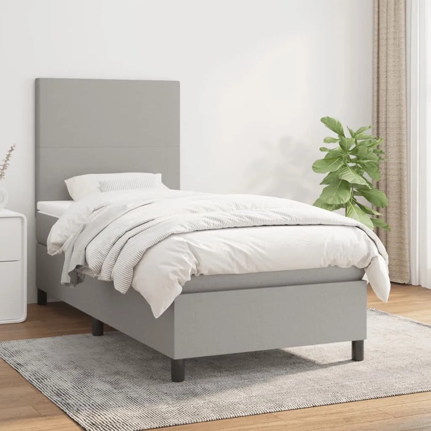 Helles, graues vidaXL Boxspringbett 90x190 cm mit Matratze und Kopfteil im Schlafzimmer.