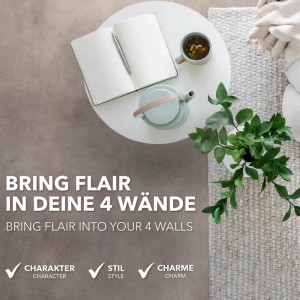 Karat CV Bodenbelag Atlantic Midas, Steinoptik, auf Wohnraum-Szene mit Tisch und Dekoration.