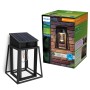 Philips Lysin Solar-Wandleuchte, schwarz, mit Solarpanel und Glühbirne in Metallrahmen.