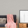 AS-Creation Vliestapete Attractive Uni grau-beige, leicht strukturiert an Wand hinter Sofa