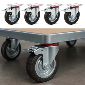Vier Wiltec Doppelstopp-Lenkrollen mit schwarzen 125mm Vollgummirädern, 100kg Tragkraft. Eine Rolle am Transportwagen.