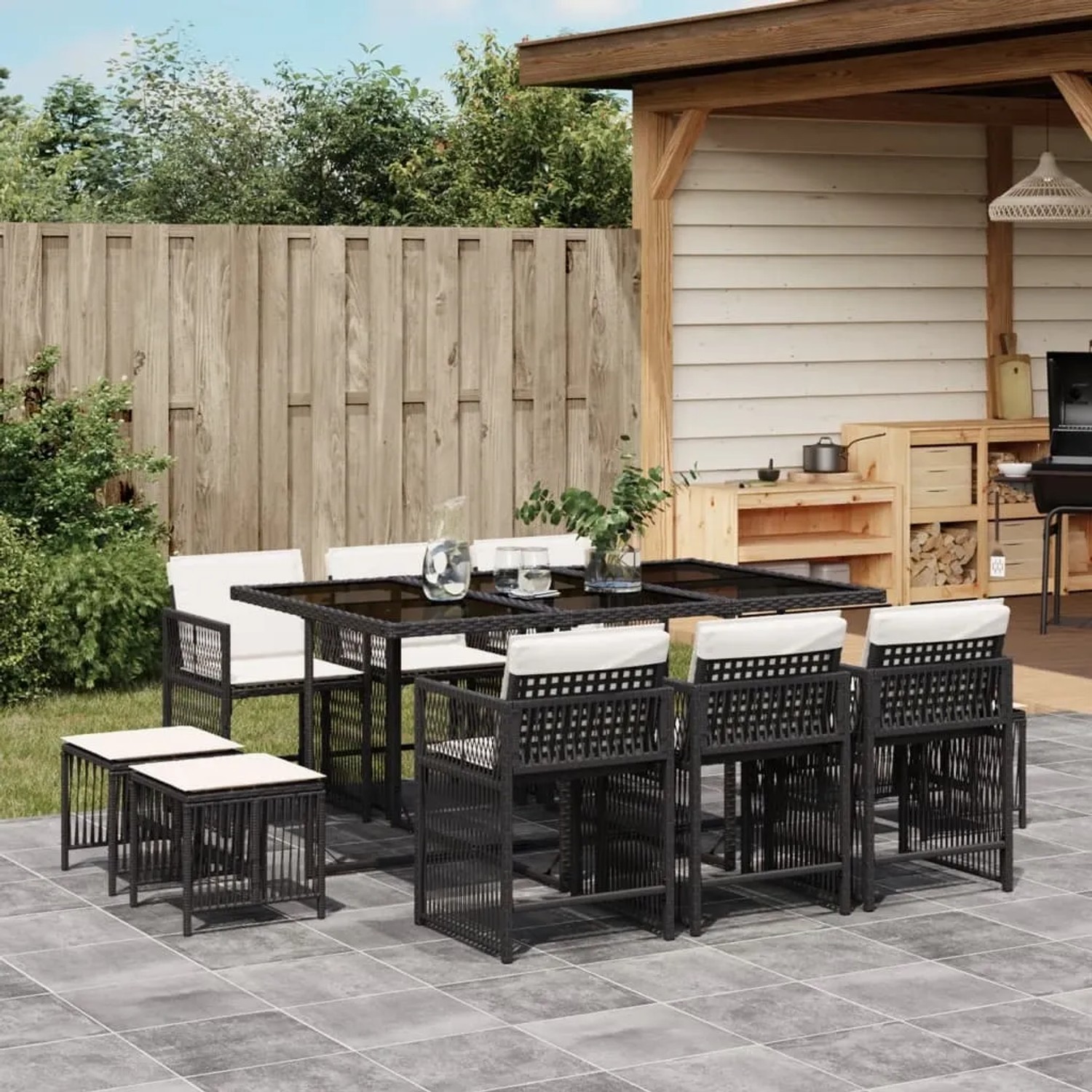 Schwarze 11-tlg. vidaXL Garten-Essgruppe aus Rattan mit Tisch, Stühlen, Hockern und Kissen.