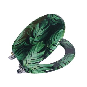 Grüner WC-Sitz mit Monstera Blätter-Muster und Absenk-Automatik. Ovaler Toilettensitz mit Chromscharnieren.