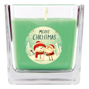 Grüne HS Candle Duftkerze im Glas mit Weihnachtsmotiv (Schneemann & Santa) für 50h Brenndauer.