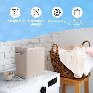 Weiße Björn&Schiller Waschmittelbox aus Metall mit Dosierlöffel auf Waschmaschine.