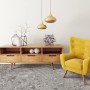 Primaflor PVC Turvo Stein Venezia, Steinoptik, 2x3m. PVC-Bodenbelag im Wohnraum mit gelbem Sessel.