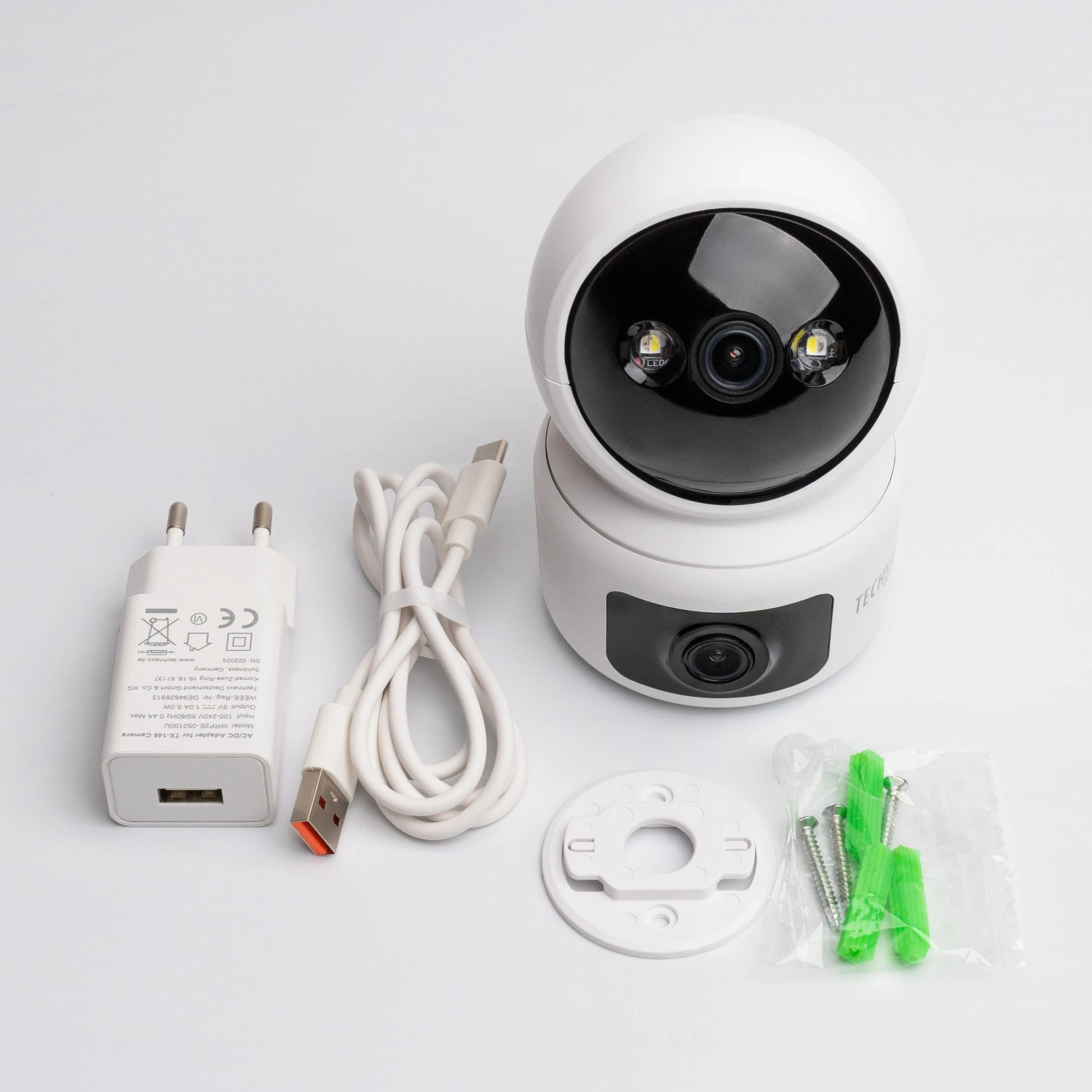 Technaxx TX-327 Dual Kamera für Innen, mit Zubehör wie Netzteil, Kabel, Schrauben und Dübel.