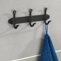 Wenko Hakenleiste Nostalgie Trio, schwarz matt, mit drei Haken und blauem Handtuch an grauer Wand.