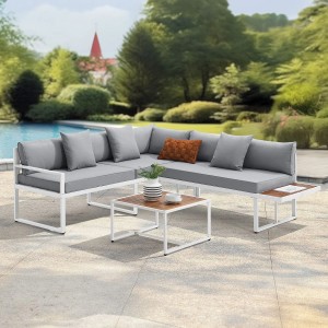 Juskys Gartenmöbel Lounge St. Tropez, weißes Ecksofa mit hellgrauen Kissen und Tisch.