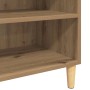 Detailansicht: Sideboard Artisan Eiche mit Regalböden und Holzfüßen.