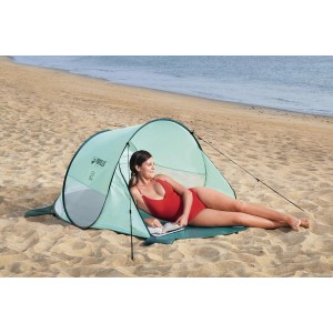 Pavillo Pop-Up Strandmuschel Beach Quick 2 Tent mit Frau am Strand.
