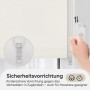 Beiges Seitenzugrollo, Verdunkelung ohne Bohren, Detailaufnahme der Sicherheitsvorrichtung.