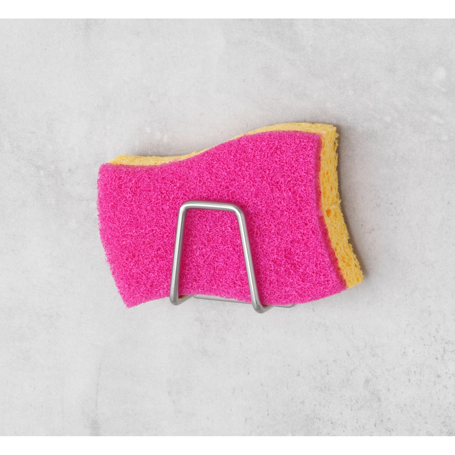 Wenko Universal-Halter Edea aus Edelstahl mit Spülschwamm in Pink/Gelb.