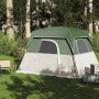 Grünes vidaXL 4-Personen Campingzelt mit beigem Boden, auf Wiese im Wald. Geräumiges Outdoor-Zelt für Camping.