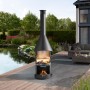 Buschbeck Edelstahlgrill Auckland Schwarz mit Grillrost im Garten.