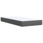 Boxspringbett 90x190 cm, dunkelgrau mit weißer Matratzenauflage.