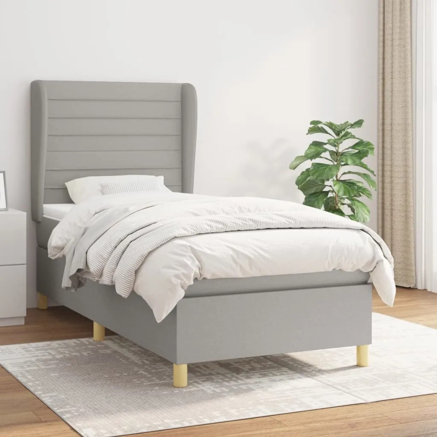 Helles Boxspringbett 80x200 cm mit Matratze, hellgrauer Stoffbezug, modernes Design für Schlafzimmer.