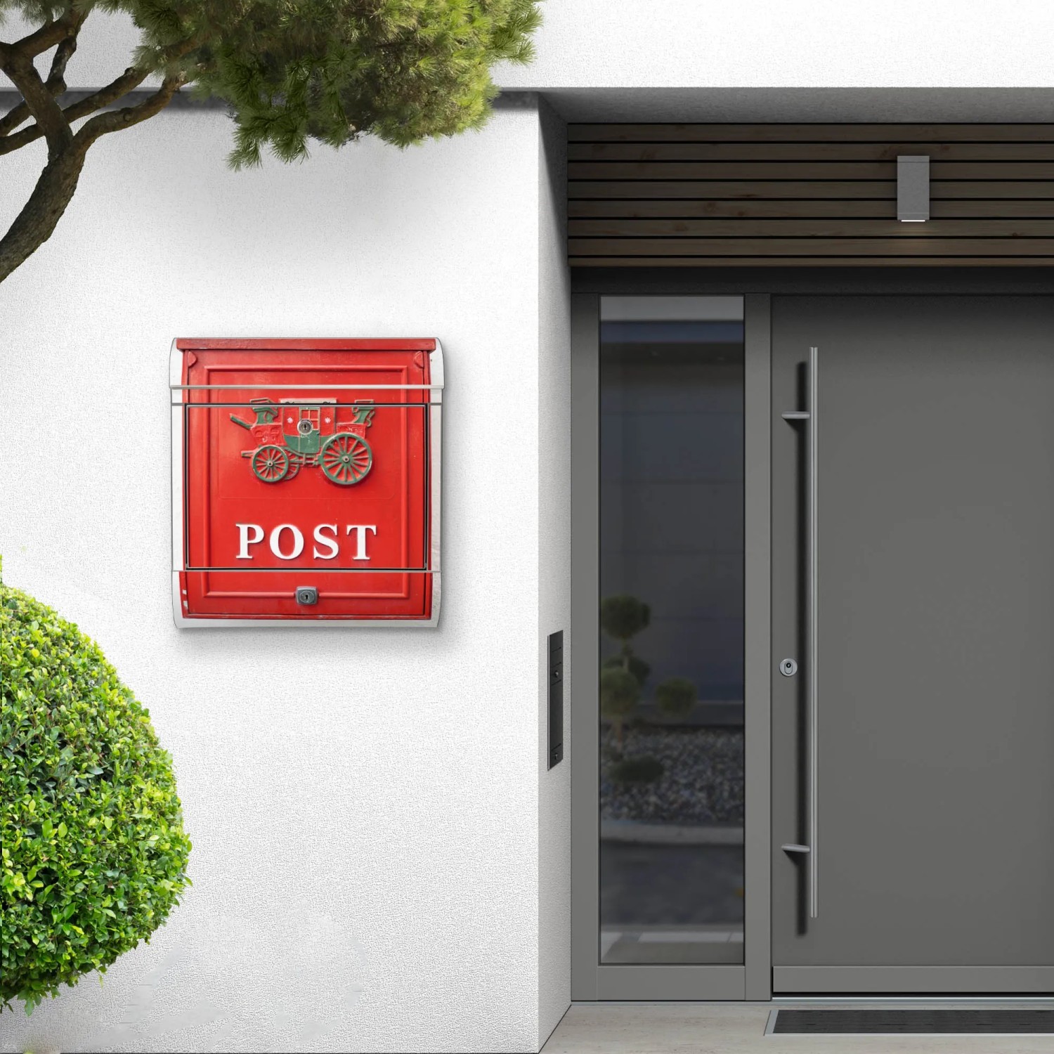 Roter Banjado Briefkasten Edelstahl mit Zeitungsfach und Nostalgie Motiv an Hauswand.