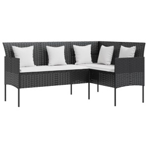 Schwarzes vidaXL L-Form Lounge-Sofa aus Rattan mit weißen Kissen für den Garten.