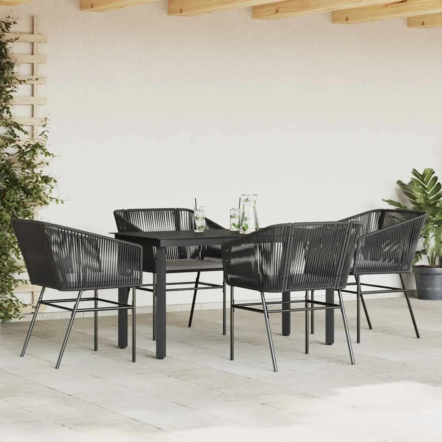 Schwarze 5-tlg. Garten-Essgruppe mit Poly Rattan Stühlen und Glastisch für den Außenbereich.