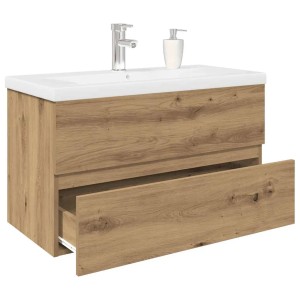 Waschbeckenunterschrank Artisan-Eiche mit weißem Einbaubecken, Wasserhahn und offener Schublade. Wandmontiertes Badmöbel.