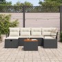 Schwarzes 7-teiliges Garten-Sofa-Set aus Poly Rattan mit Kissen und Tisch.