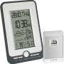 TFA Funk-Wetterstation Multi in Schwarz-Silber mit Außensensor zeigt Temperatur, Luftfeuchtigkeit und Wetterprognose.