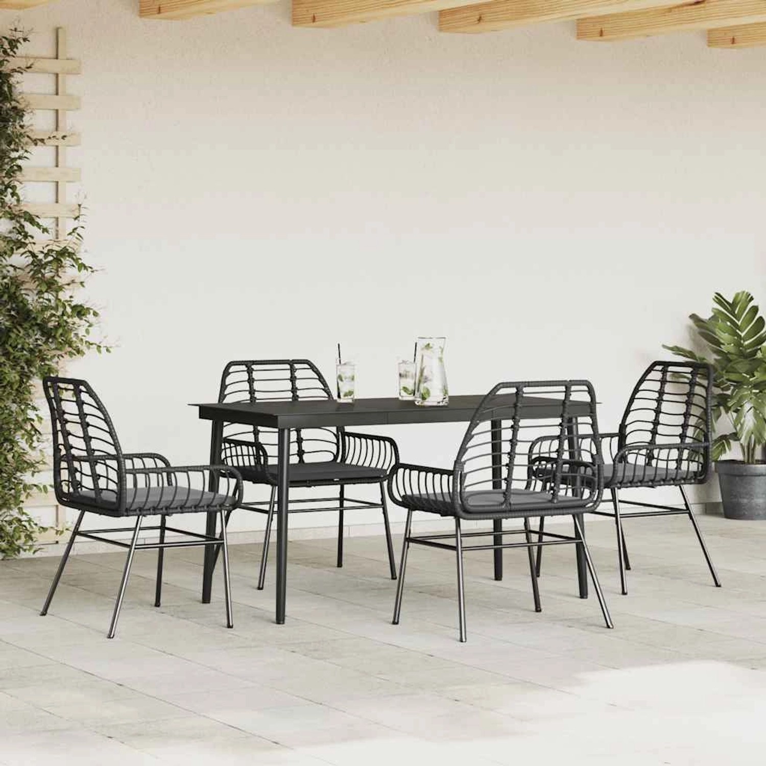 Schwarze 5-tlg. Garten-Essgruppe aus Polyrattan mit Glattisch und Kissen.