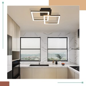 Moderne schwarze LED Deckenlampe mit zwei überlappenden quadratischen Elementen, warmweißes Licht, in einer Küche.
