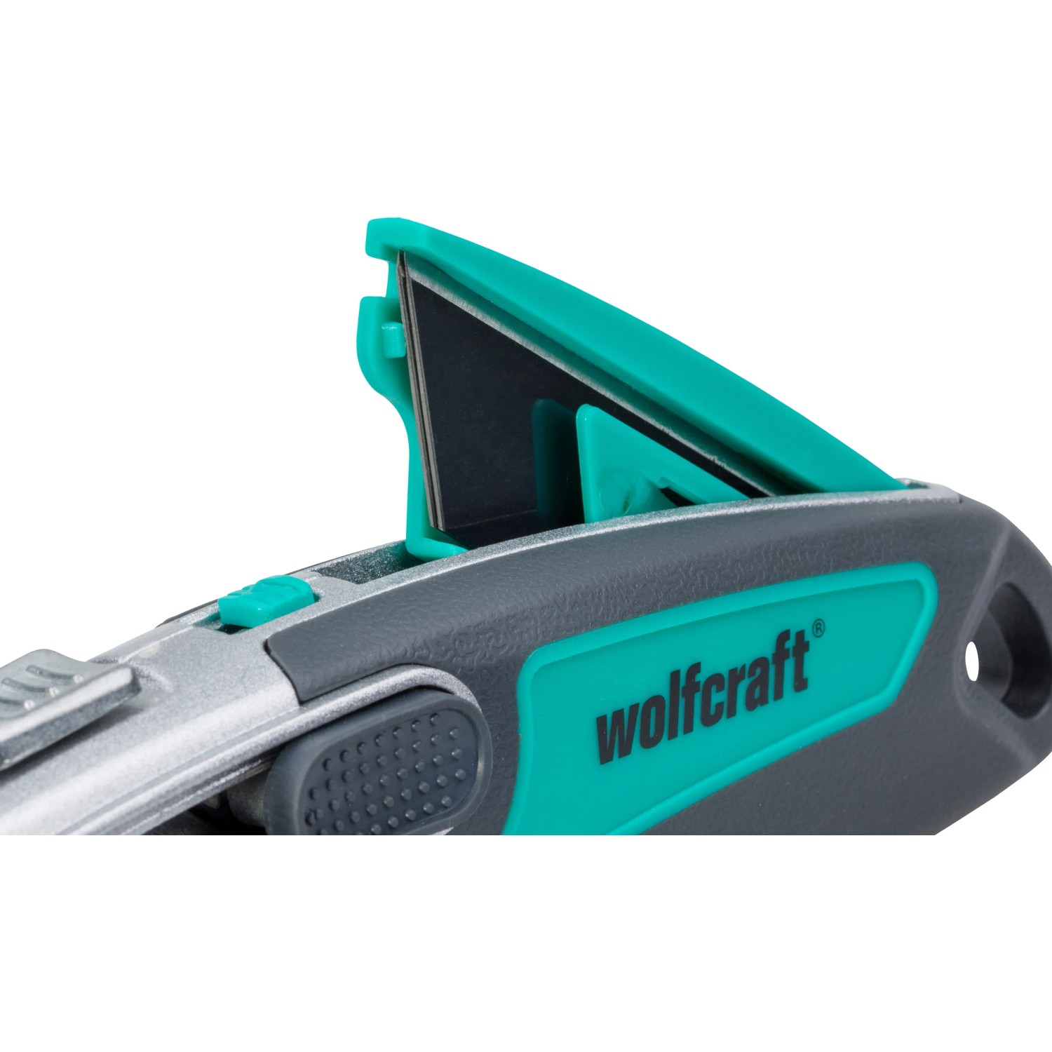 Wolfcraft Profi-Dual-Sicherheitsmesser mit Trapezklinge, graues Metallgehäuse und grünen Akzenten.