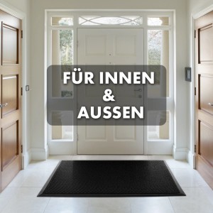 Schwarze KARAT Fußmatte Imperial 1000 mit 3D-Netz, 90x120 cm, vor einer weißen Tür.