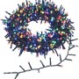 OBI LED Lichterkette, 700 mehrfarbige LEDs auf grünem Kabel, zusammengerollt. Für stimmungsvolle Außenbeleuchtung.
