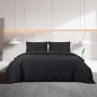 Schwarzes Baumwoll-Bettwäsche-Set 200x200 cm mit zwei Kissenbezügen in modernem Schlafzimmer.