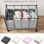 Grauer Songmics Wäschesammler mit 4 Fächern und Rollen zum Sortieren der Wäsche.