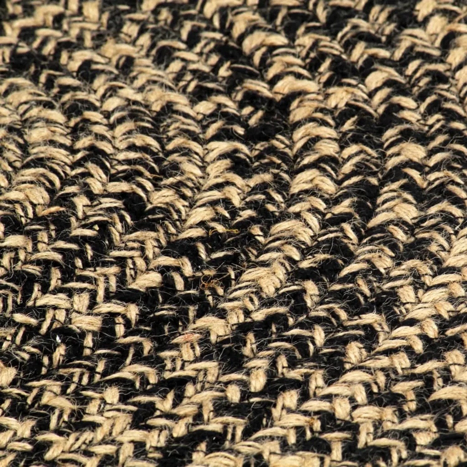 Detailansicht: Handgefertigter, runder Jute Teppich in Schwarz und Braun, 210 cm Durchmesser.