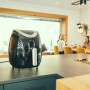 Severin Heißluft-Fritteuse FR 2430 (1500 W) in Schwarz/Edelstahl-Optik auf Küchentheke.