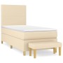Cremefarbenes Boxspringbett 90x190 cm mit Matratze und Bank, Stoffbezug.