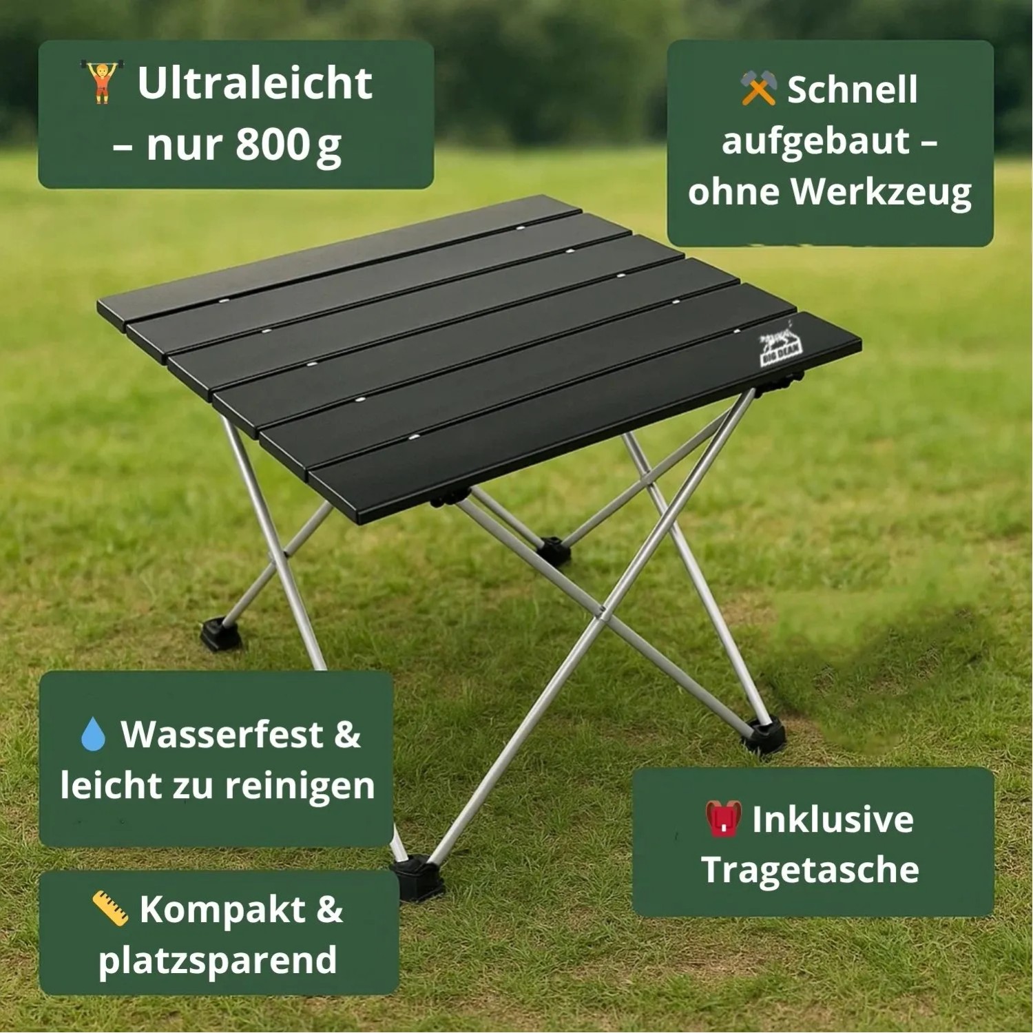 Schwarzer BigDean Klapptisch, faltbar, mit Aluminiumplatte und silbernen Beinen auf Gras. Ultraleicht, kompakt, schnell aufgebaut.