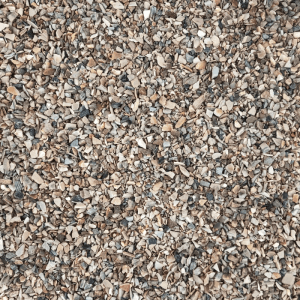 Supravit Vogelgrit: Nahaufnahme von feinem Mineralgrit in Braun- und Grautönen, wichtig für die Verdauung von Vögeln.