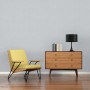 AS-Creation Vliestapete Attractive, Blätter grau/weiß, im Wohnraum mit Sessel und Kommode.