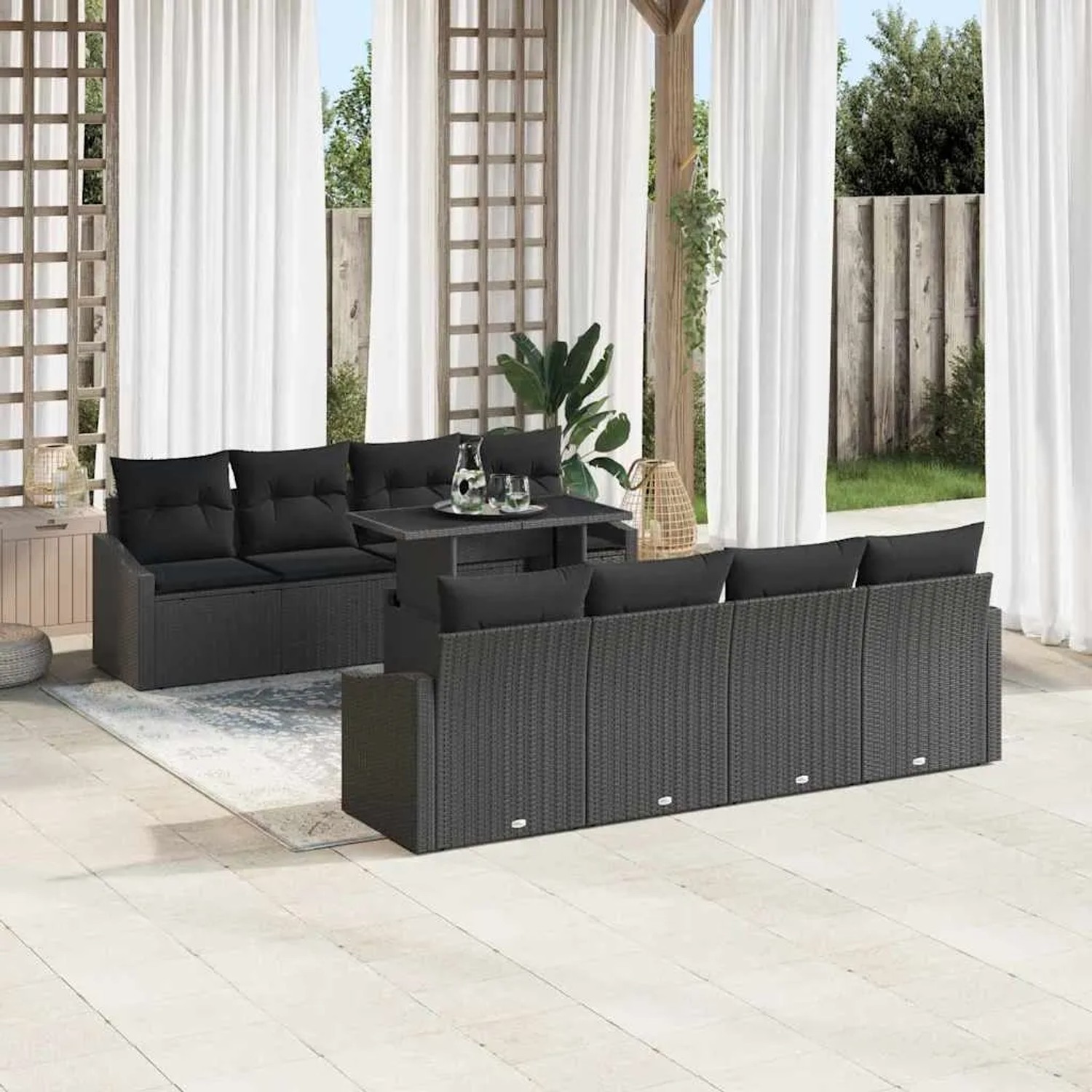 Schwarzes 9-teiliges Garten-Sofa-Set aus Poly Rattan mit Tisch und Auflagen für Terrasse und Garten.