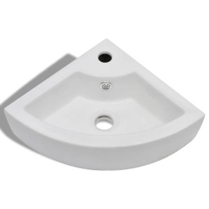 Weißes Keramik Eckwaschbecken mit Überlauf und Hahnloch. Glänzendes, modernes Design für Ihr Bad.