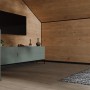 Wohnraum mit Egger Wandverkleidung Decowall und schwarzer Winkelleiste für saubere Abschlüsse.